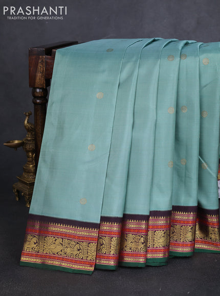 Pure kanchipuram silk saree pastel green and green coffee brown with zari woven buttas and zari woven korvai border