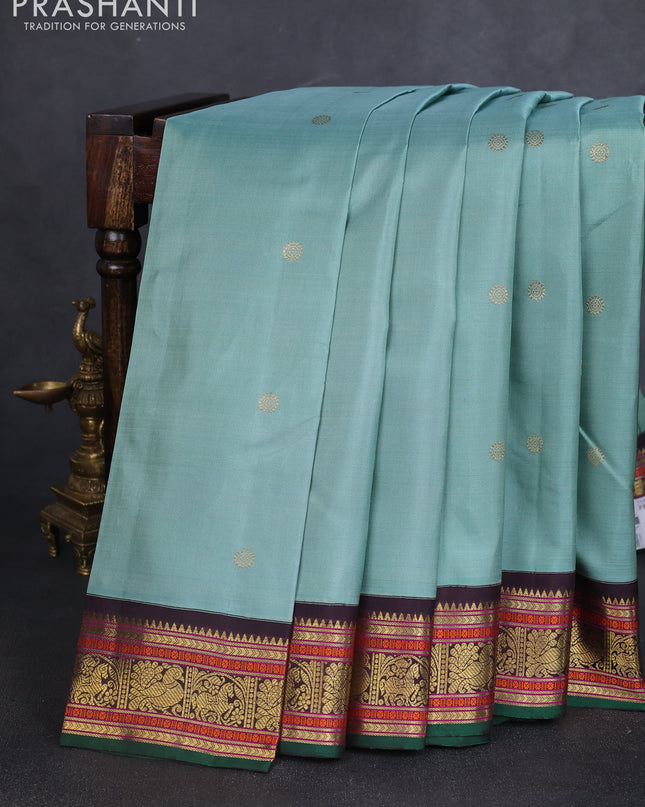 Pure kanchipuram silk saree pastel green and green coffee brown with zari woven buttas and zari woven korvai border