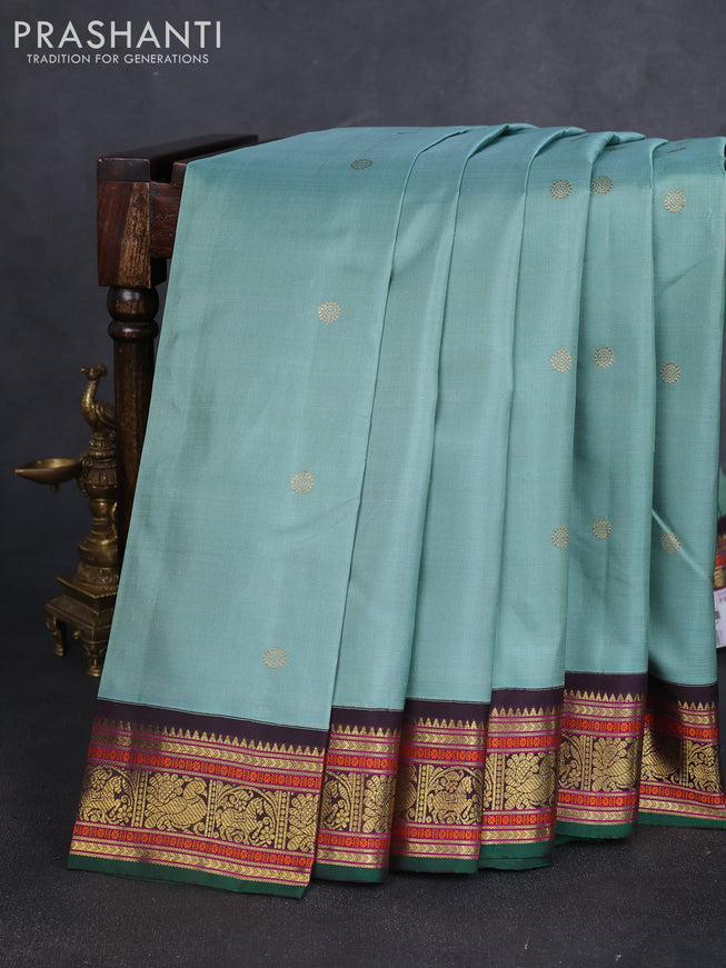 Pure kanchipuram silk saree pastel green and green coffee brown with zari woven buttas and zari woven korvai border