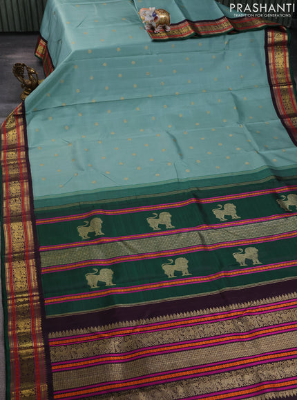 Pure kanchipuram silk saree pastel green and green coffee brown with zari woven buttas and zari woven korvai border