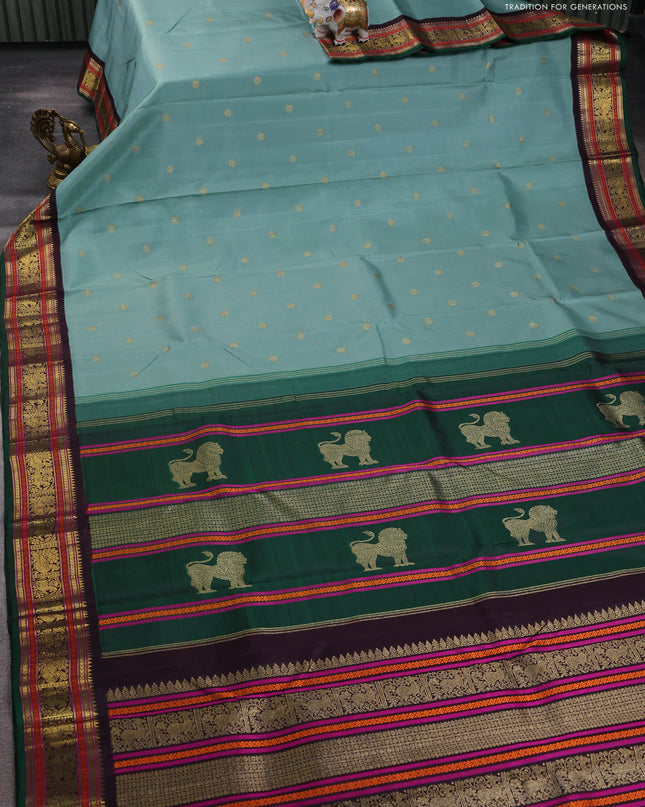 Pure kanchipuram silk saree pastel green and green coffee brown with zari woven buttas and zari woven korvai border