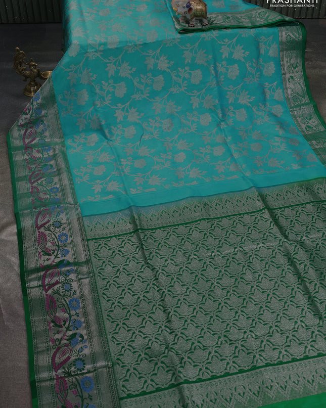 Venkatagiri silk saree light blue and green with allover silver zari weaves and silver zari woven peacock border