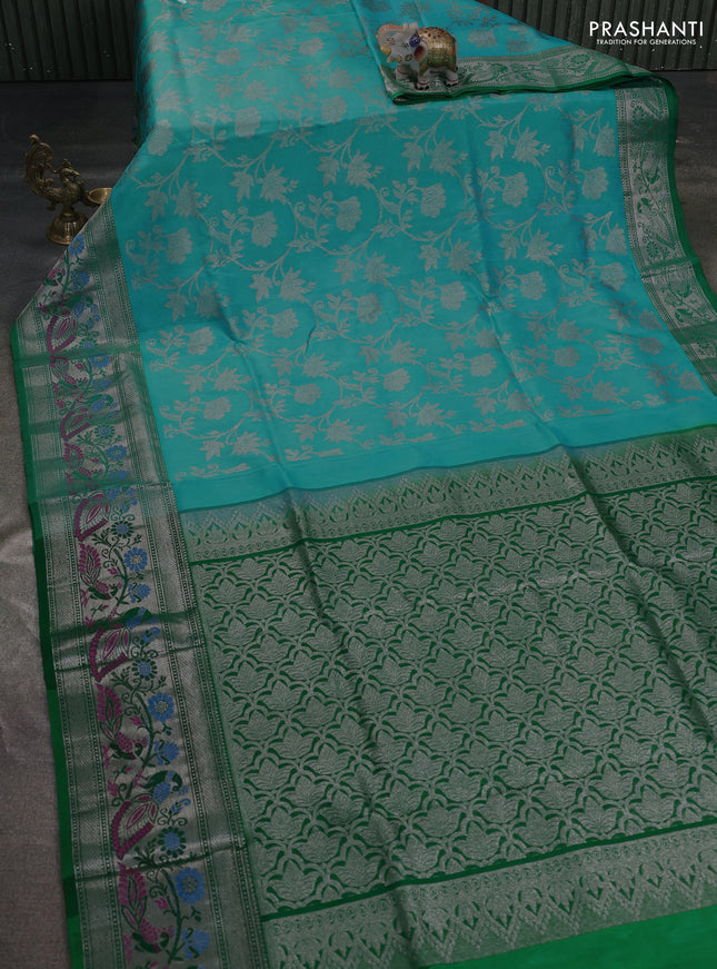 Venkatagiri silk saree light blue and green with allover silver zari weaves and silver zari woven peacock border