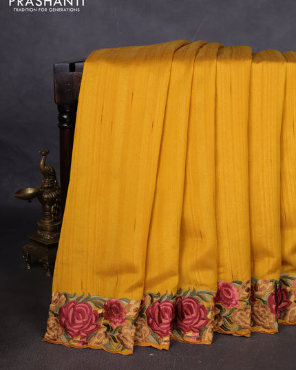 Art tussar saree yellow with plain body and floral embroidery border