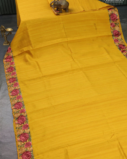 Art tussar saree yellow with plain body and floral embroidery border