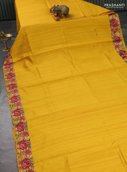 Art tussar saree yellow with plain body and floral embroidery border