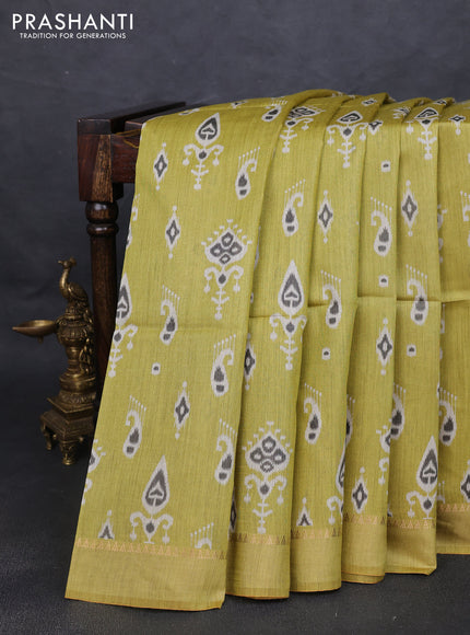 Munga tussar silk saree lime yellow with allover ikat butta prints and zari woven border