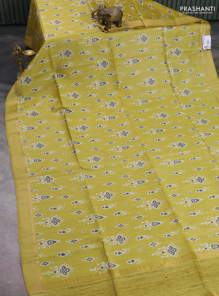 Munga tussar silk saree lime yellow with allover ikat butta prints and zari woven border