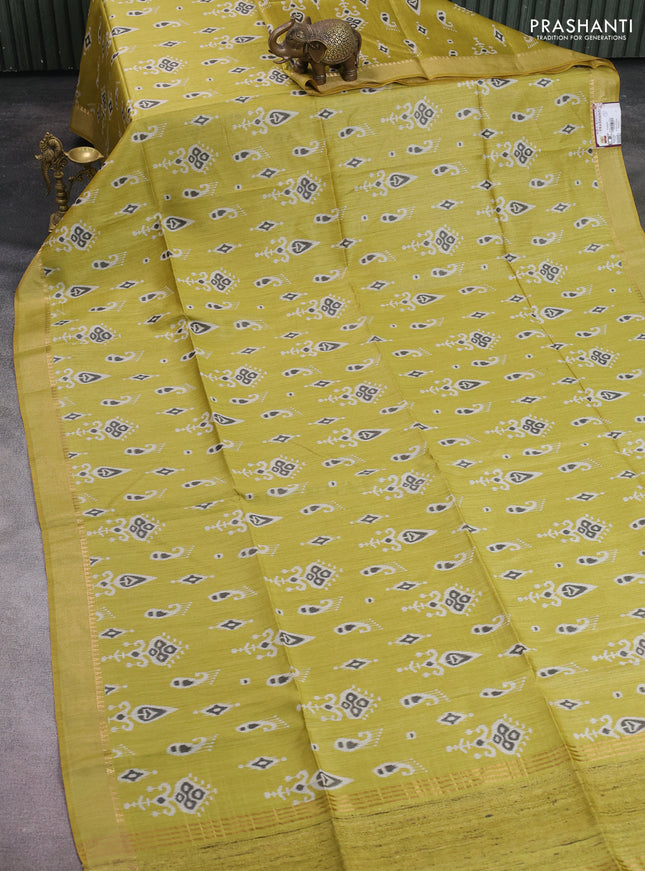 Munga tussar silk saree lime yellow with allover ikat butta prints and zari woven border