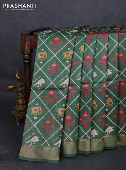 Munga tussar silk saree green with allover patola prints and zari woven border