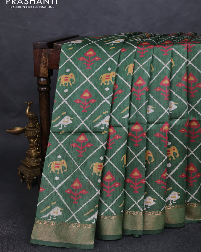 Munga tussar silk saree green with allover patola prints and zari woven border