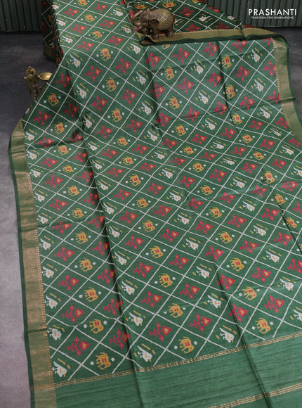 Munga tussar silk saree green with allover patola prints and zari woven border