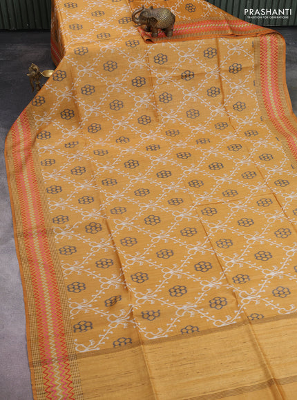 Munga tussar silk saree mustard yellow with allover patola prints and thread woven border