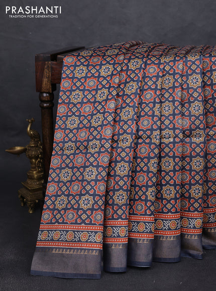 Munga tussar silk saree navy blue with allover ajrakh prints and zari woven border
