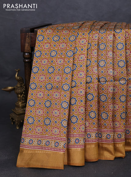 Munga tussar silk saree dark mustard with allover ajrakh prints and zari woven border