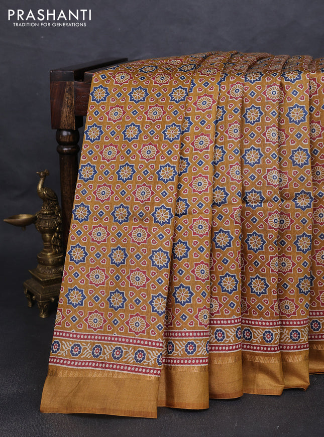 Munga tussar silk saree dark mustard with allover ajrakh prints and zari woven border