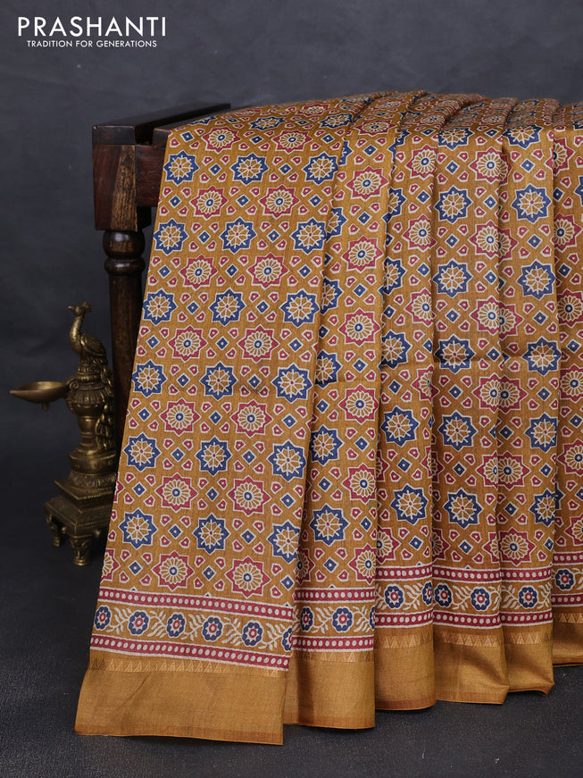 Munga tussar silk saree dark mustard with allover ajrakh prints and zari woven border