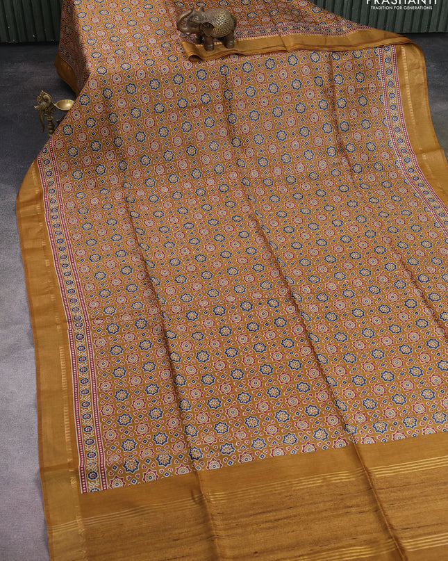 Munga tussar silk saree dark mustard with allover ajrakh prints and zari woven border