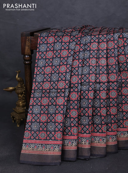 Munga tussar silk saree black with allover ajrakh prints and zari woven border