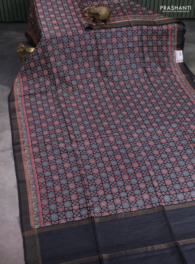 Munga tussar silk saree black with allover ajrakh prints and zari woven border