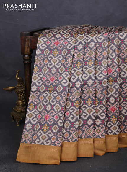 Munga tussar silk saree grey and dark mustard with allover ikat prints and zari woven border