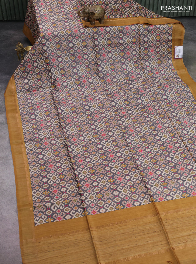 Munga tussar silk saree grey and dark mustard with allover ikat prints and zari woven border