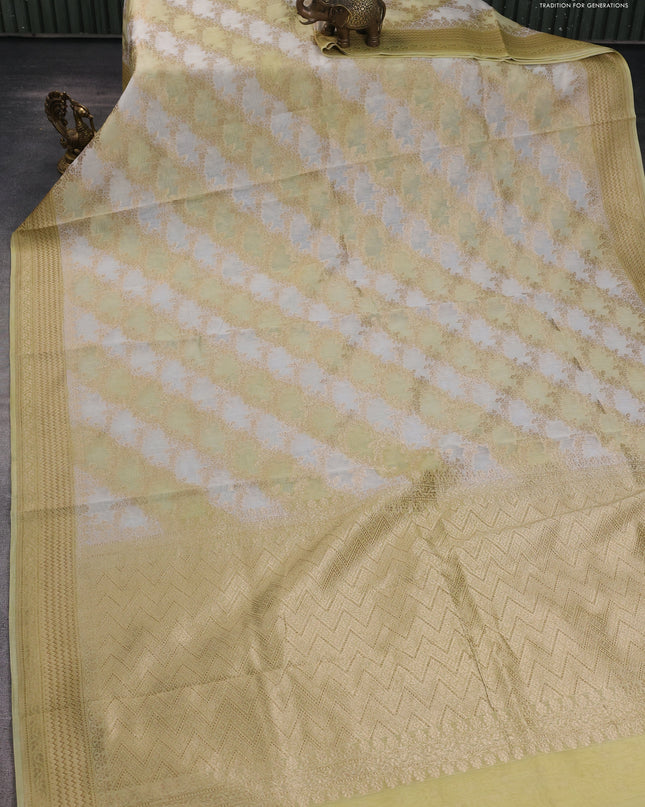 Banarasi silk cotton saree off white and pale yellow with allover zari weaves and zari woven border
