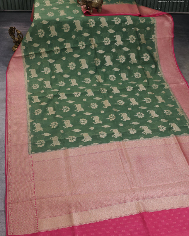 Banarasi silk cotton saree green and pink with zari woven buttas and woven border