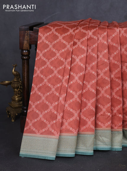 Banarasi silk cotton saree rustic orange and pastel green with allover thread weaves and woven border