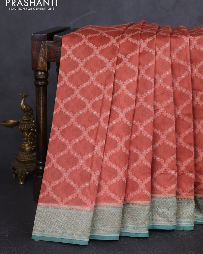 Banarasi silk cotton saree rustic orange and pastel green with allover thread weaves and woven border
