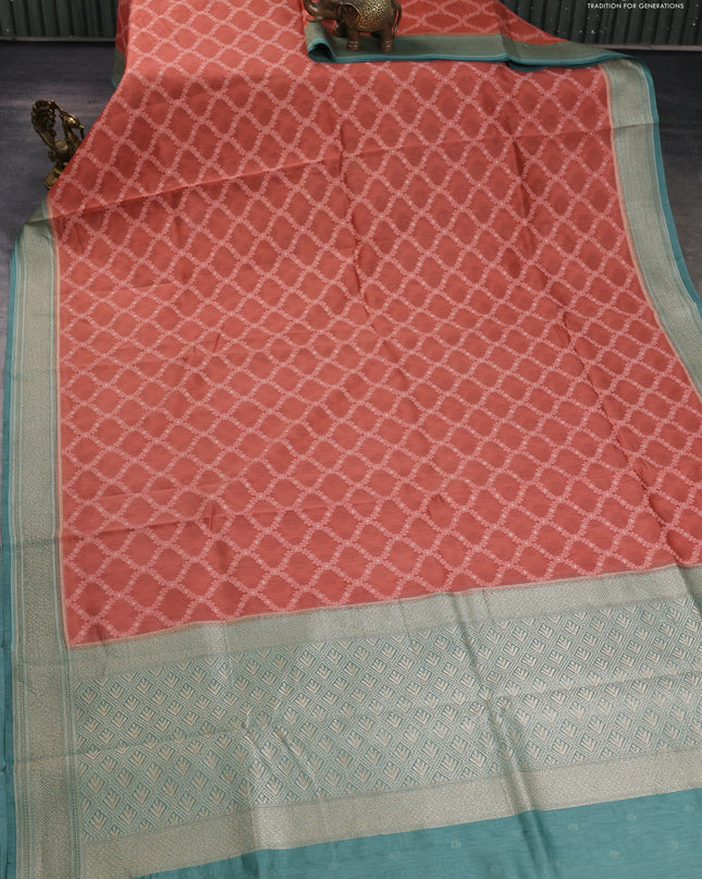 Banarasi silk cotton saree rustic orange and pastel green with allover thread weaves and woven border