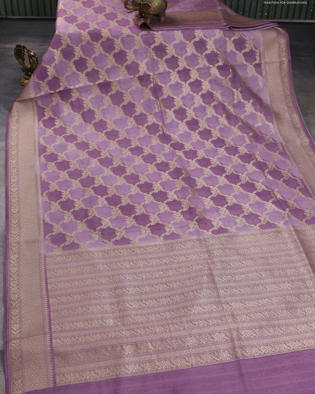 Banarasi silk cotton saree pastel purple with allover zari weaves and zari woven border