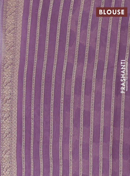 Banarasi silk cotton saree pastel purple with allover zari weaves and zari woven border