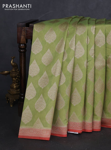 Banarasi silk cotton saree light green and peach pink with allover zari woven buttas and zari woven border