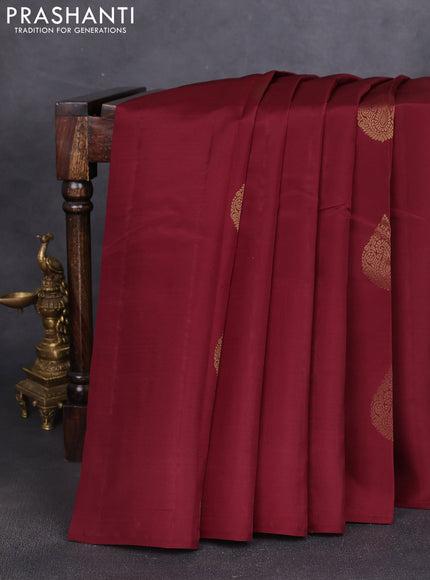 Kanchipuram silk saree maroon and pastel pink with zari woven buttas in borderless style
