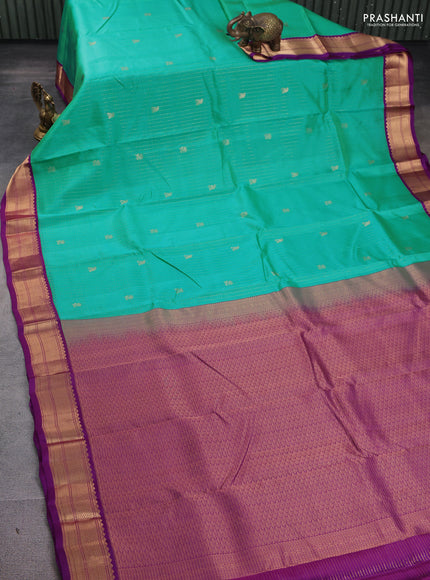Kanchipuram silk saree teal blue and purple with allover small zari checks & buttas and rich zari woven korvai border