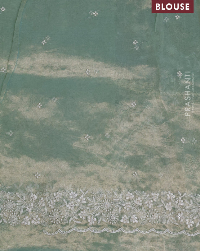 Tissue silk saree pastel green with allover embroidery & sequin work