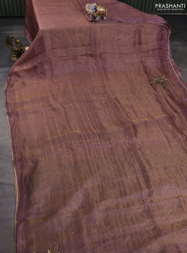 Tissue silk saree dual shade of purple with beaded work and lace work embroidery border