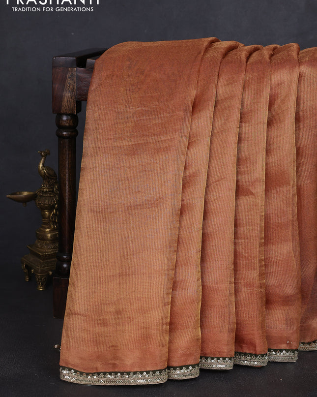 Tissue silk saree sandal with plain body and lace work embroidery border