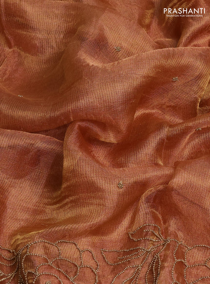 Tissue silk saree rust shade with beaded work and beaded work embroidery border