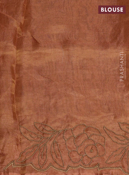 Tissue silk saree rust shade with beaded work and beaded work embroidery border