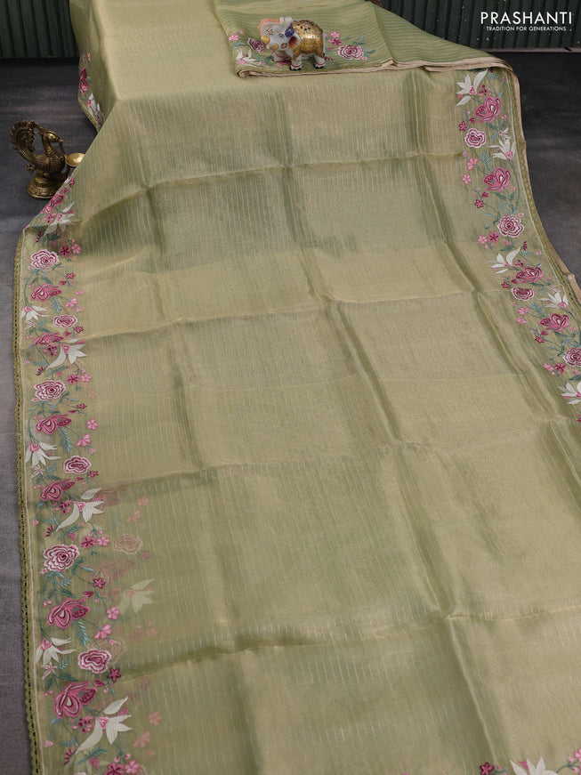 Tissue silk saree elachi green with allover zari weaves and kutch embroidery border
