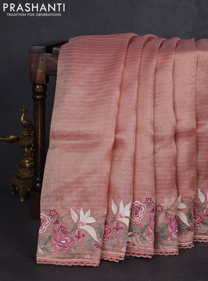 Tissue silk saree peach shade with allover zari weaves and kutch embroidery border