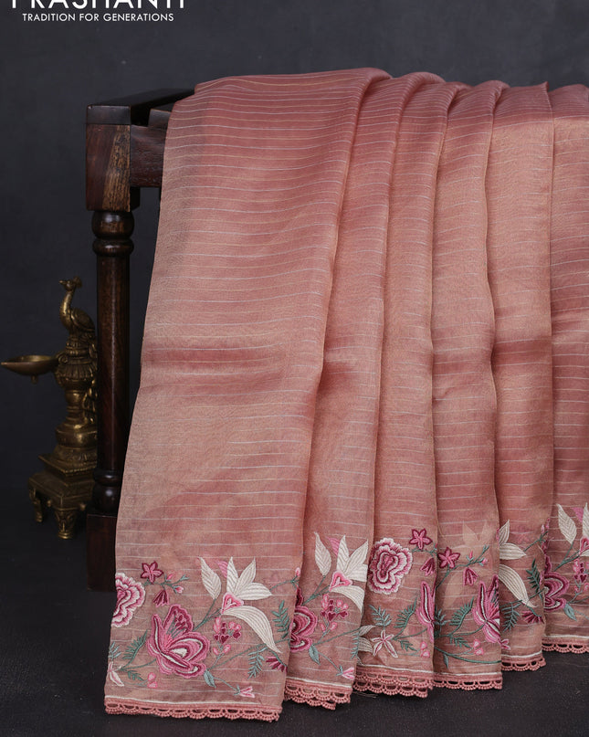 Tissue silk saree peach shade with allover zari weaves and kutch embroidery border