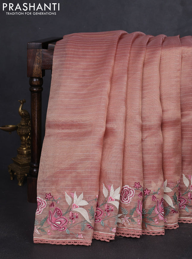 Tissue silk saree peach shade with allover zari weaves and kutch embroidery border