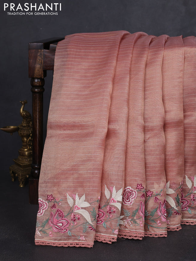 Tissue silk saree peach shade with allover zari weaves and kutch embroidery border