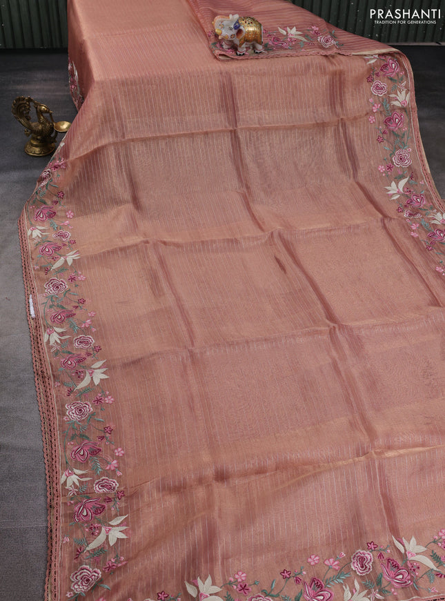 Tissue silk saree peach shade with allover zari weaves and kutch embroidery border