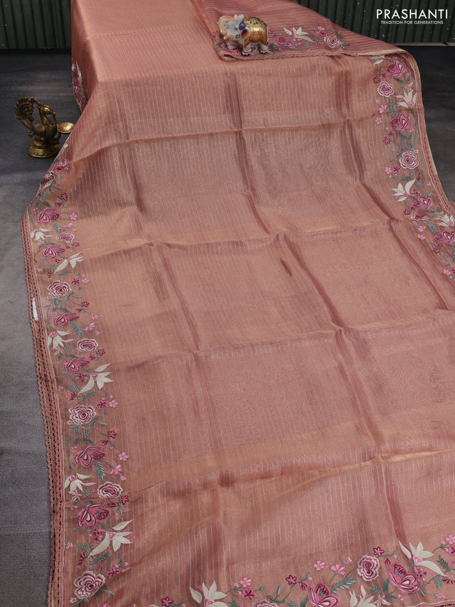 Tissue silk saree peach shade with allover zari weaves and kutch embroidery border