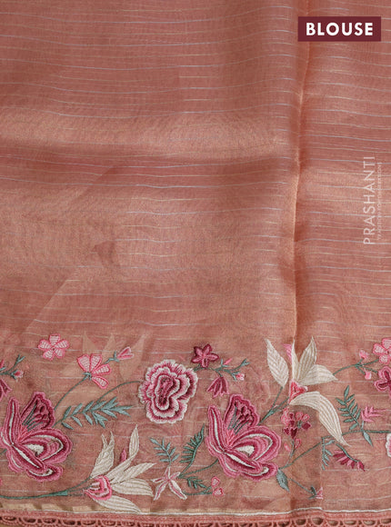 Tissue silk saree peach shade with allover zari weaves and kutch embroidery border