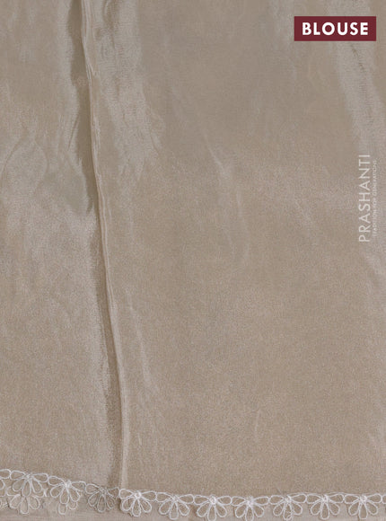 Tissue silk saree off white with allover floral applique work and embroidery border